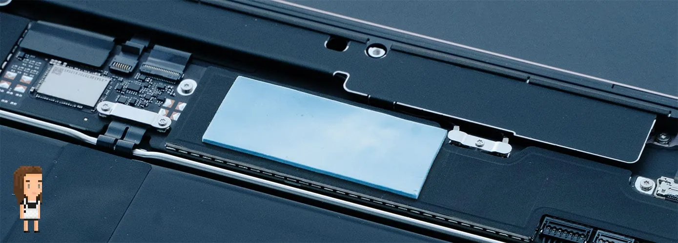 MacBook Neo internals showing the 1mm thermal pad placed over the graphite sticker covering the A18 Pro